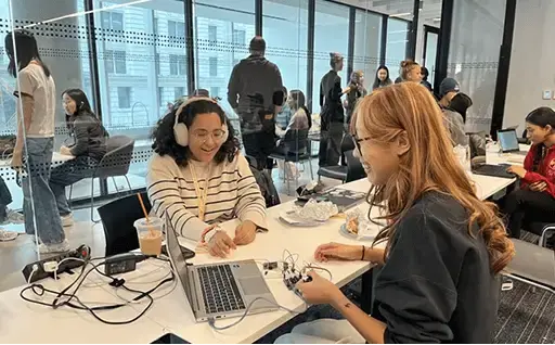 Two girls working on a project together